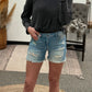 MID-RISE FRINGE HEM SHORTS