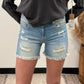 MID-RISE FRINGE HEM SHORTS